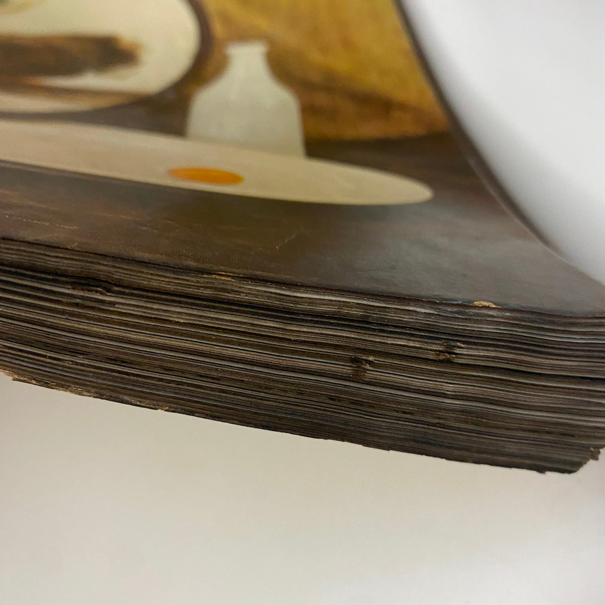 Close-up image of the spine of a vintage Vogue magazine, showing aged edges and wear from Vogue Magazine May 1, 1947 Summer Beauty Brides by Irving Penn.
