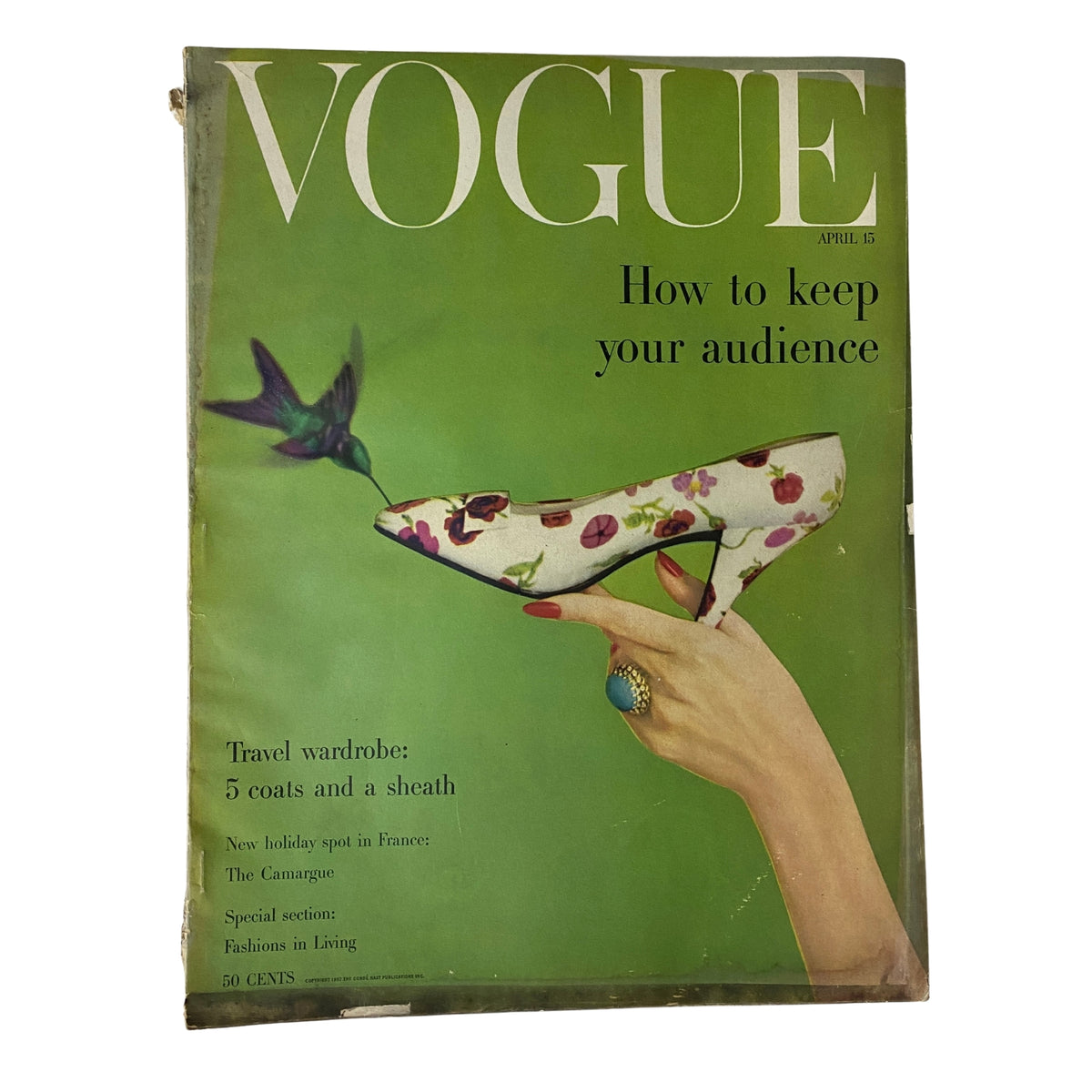 Cover of Vogue Magazine April 15, 1957, featuring the title 'How To Keep Your Audience' with a vibrant green background and an elegant shoe adorned with floral patterns. This vintage issue showcases mid-century fashion aesthetics.