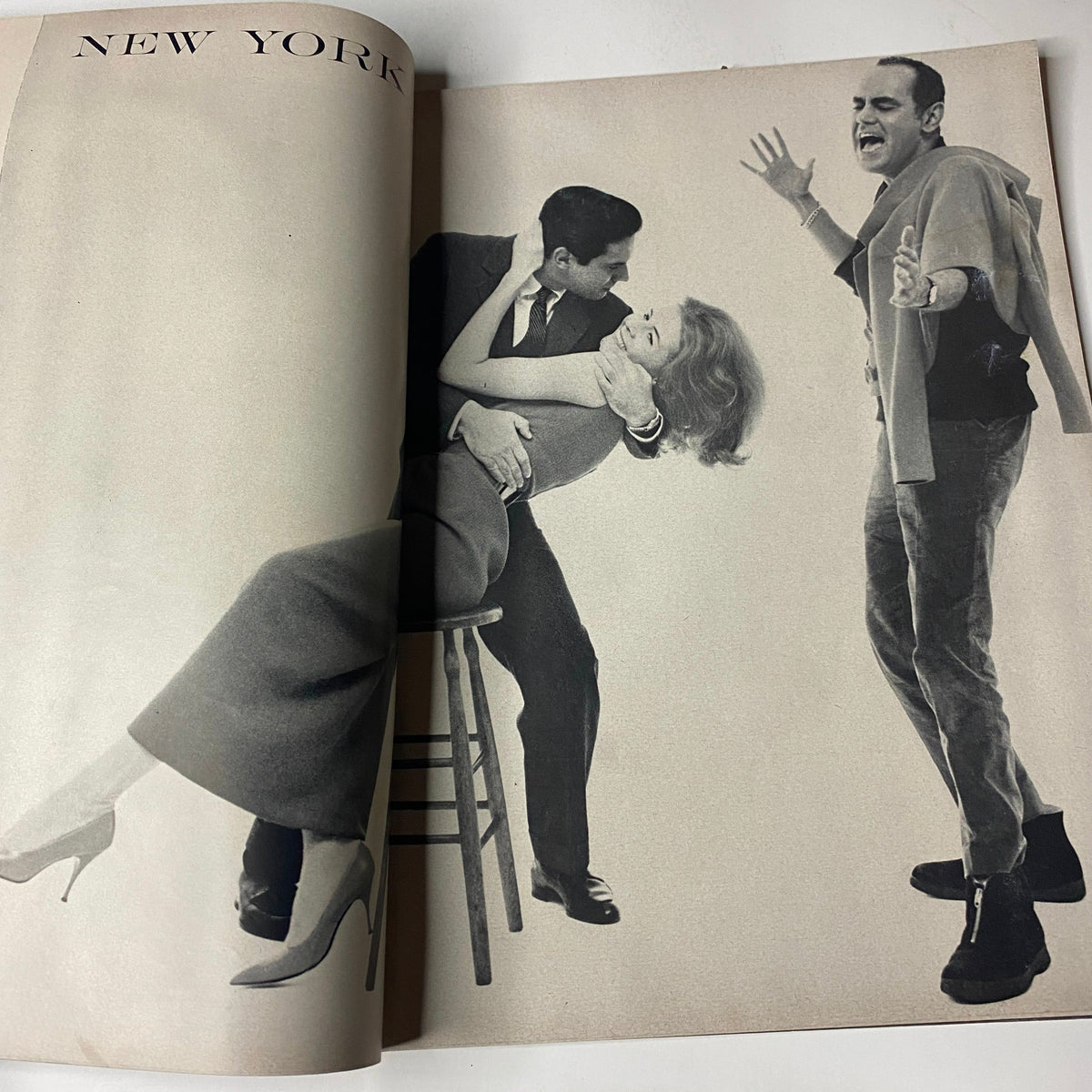 Editorial spread from Vogue Magazine March 15, 1962 featuring a humorous black and white fashion scene with models and a director, capturing the vibrant social life of the era.