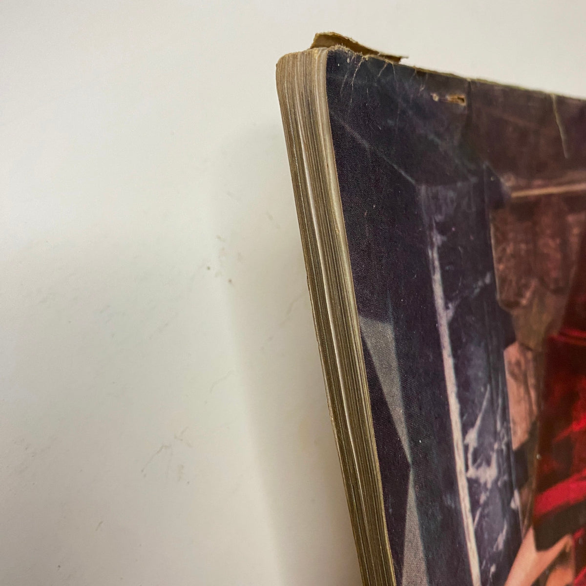View of the spine of Vogue Magazine November 1, 1955 Anne St. Marie cover highlighting its aged condition and binding.