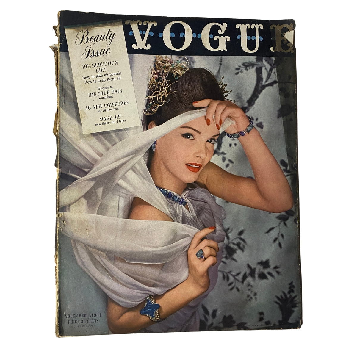 Cover of Vogue Magazine, November 1, 1941 featuring Bettina Bolegard, photographed by Horst P. Horst, showcasing a classic beauty theme with the headline 'Beauty Issue.' Historical collectible.