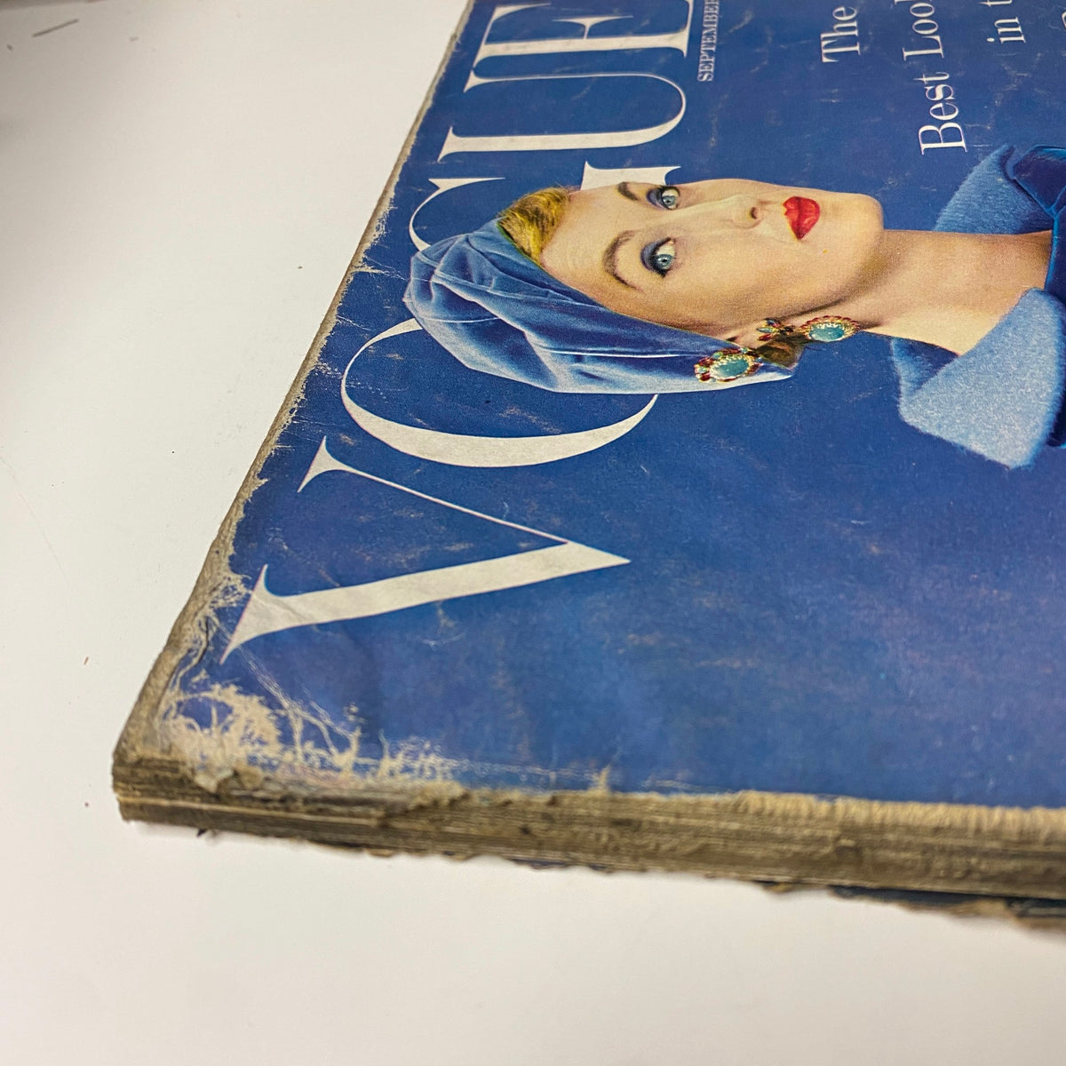 Cover of Vogue Magazine September 1, 1954 featuring Evelyn Tripp, photographed by Erwin Blumenfeld, showcasing vintage wear and visible aging marks.