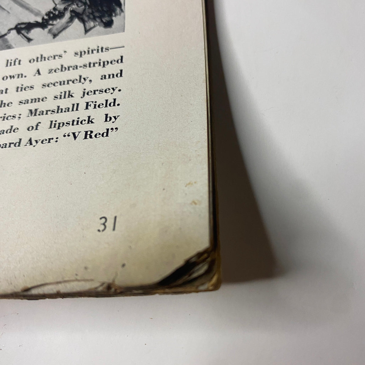 Bottom corner of the page from Vogue Magazine January 15, 1942, showing wear and the page number, connected to the theme 'New Design for Our Double-Duty Lives'.