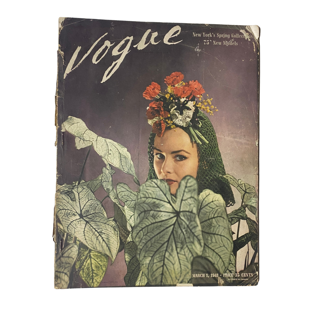 Cover of Vogue Magazine March 1, 1941 featuring Tina McDonnell, adorned with floral headpiece, surrounded by large green leaves.