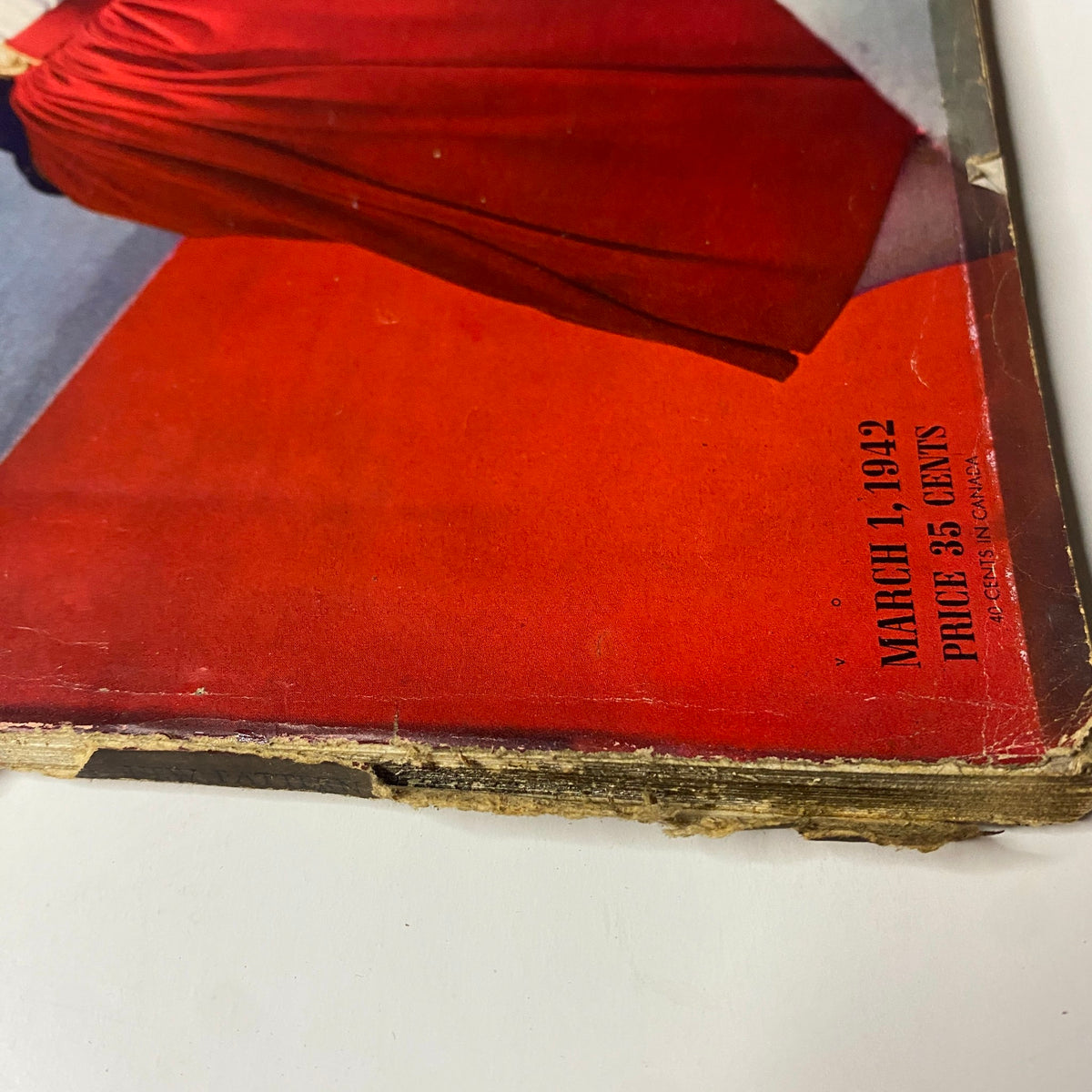 Detailed view of the date and price on Vogue Magazine March 1, 1942 Wartime Look cover by Horst P. Horst, emphasizing its historical significance.