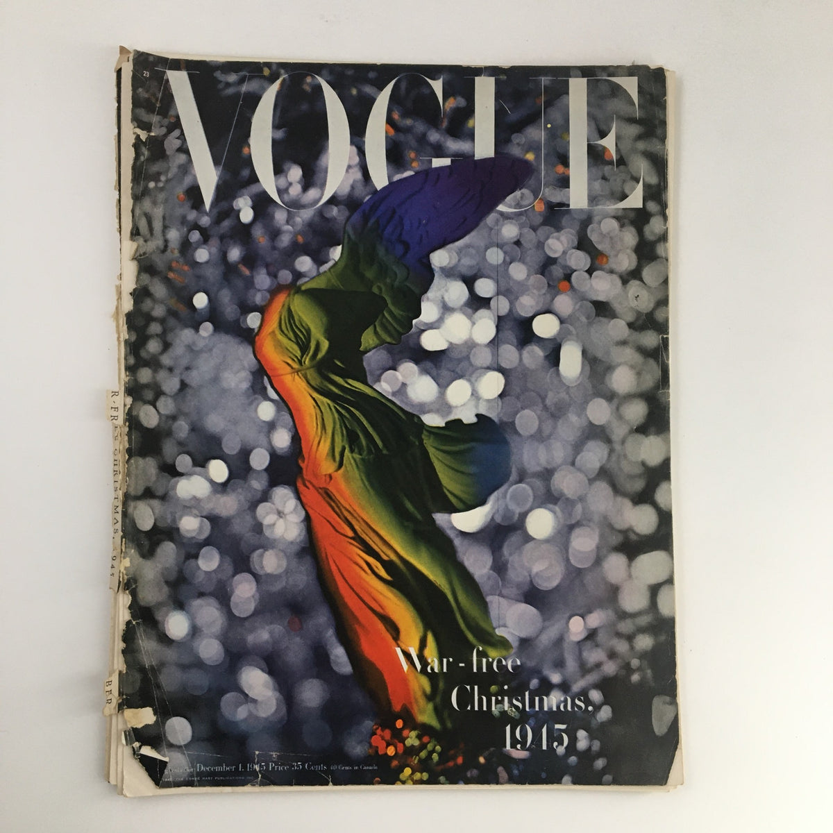 VTG Vogue Magazine December 1 1945 The War-Free Christmas cover featuring a colorful design and festive theme, highlighting the magazine's historical significance.