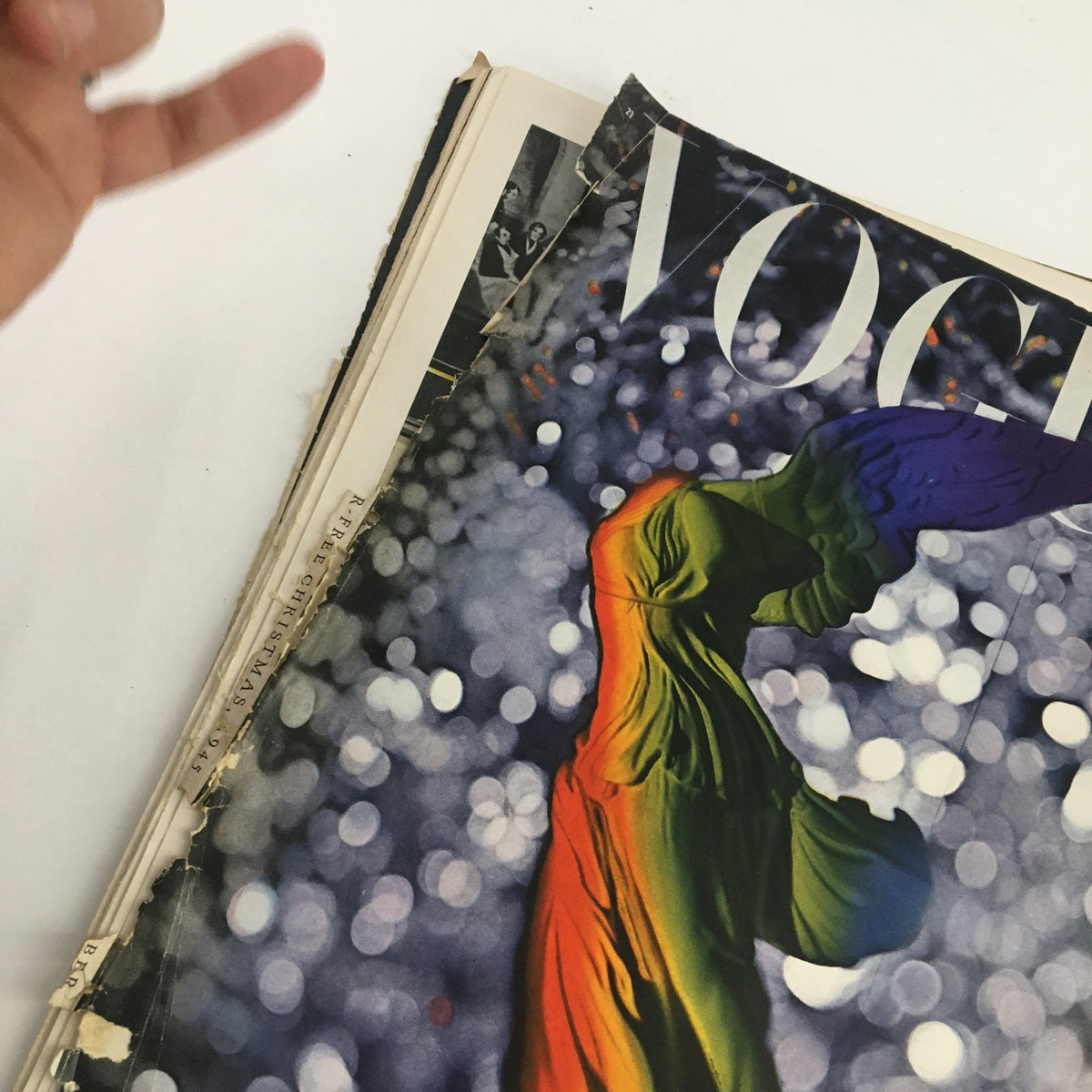 VTG Vogue Magazine December 1 1945 The War-Free Christmas showing the magazine's cover and spine, emphasizing its vintage condition and unique artwork.