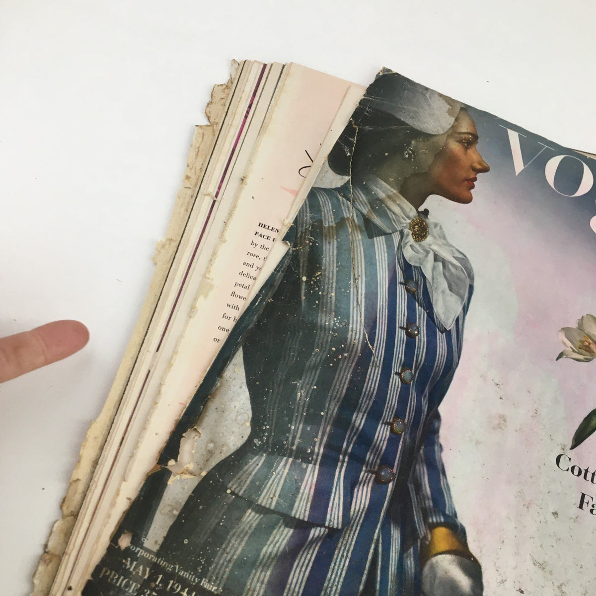 Image showing the side of the Vintage Vogue Magazine May 1 1944, capturing the wear and vintage character of the publication.