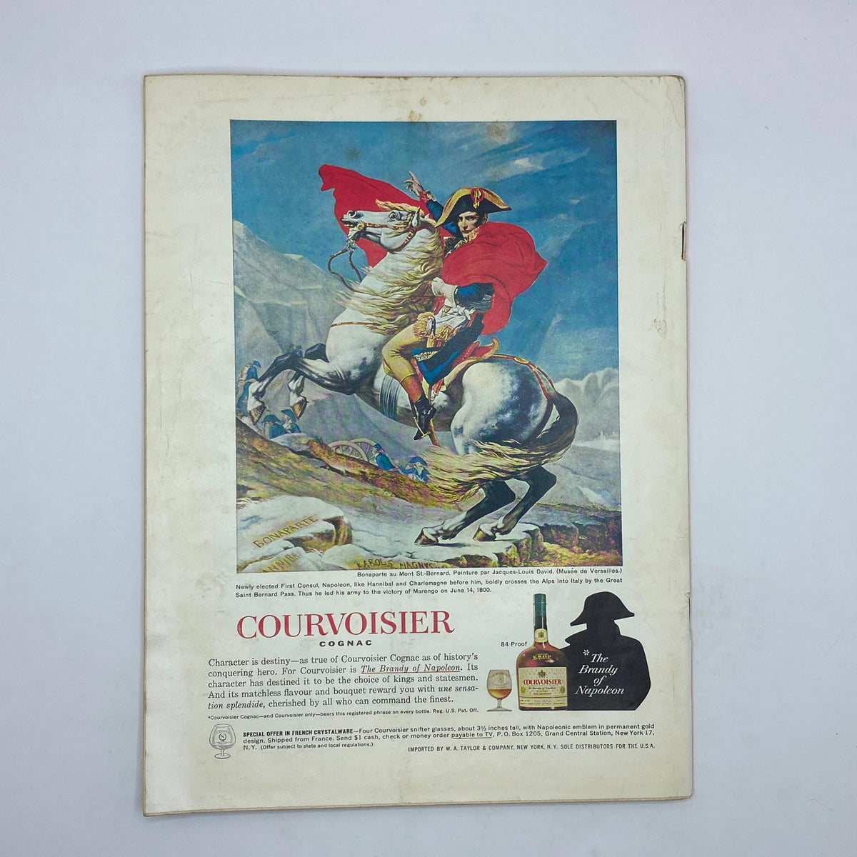 The New Yorker Complete Magazine June 1, 1963 showcasing an advertisement for Courvoisier Cognac with an artistic depiction of Napoleon on horseback, highlighting the premium brand and its historical significance.