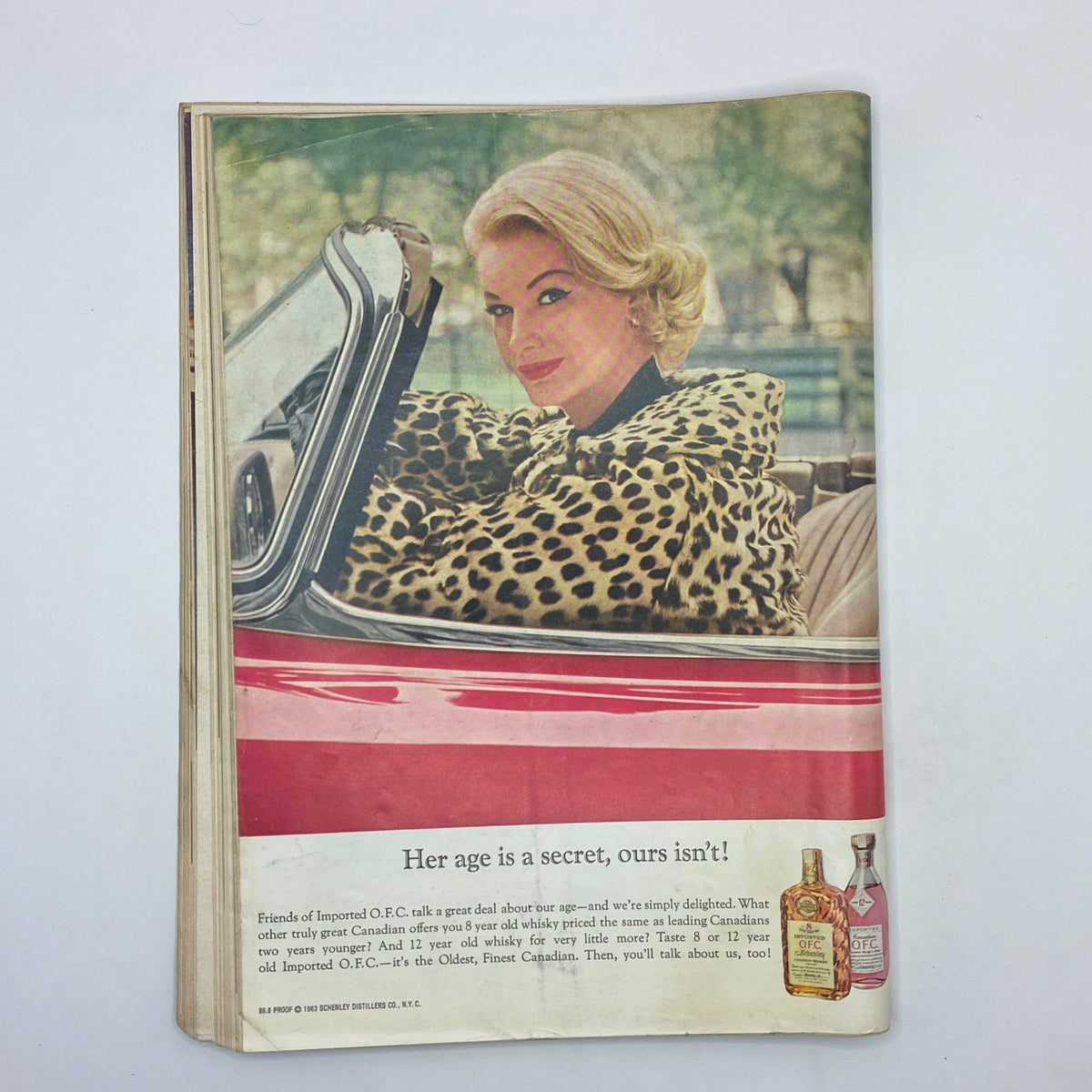 Advertisement from The New Yorker Complete Magazine June 8, 1963, featuring a glamorous woman in a convertible dressed in a leopard print coat.