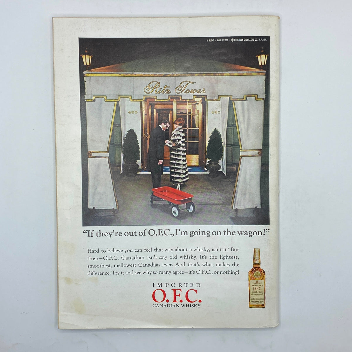 Advertisement for O.F.C. Canadian Whisky from The New Yorker magazine September 24, 1966, featuring a scene at the Ritz Tower with a man and woman, emphasizing the preferred whisky choice.