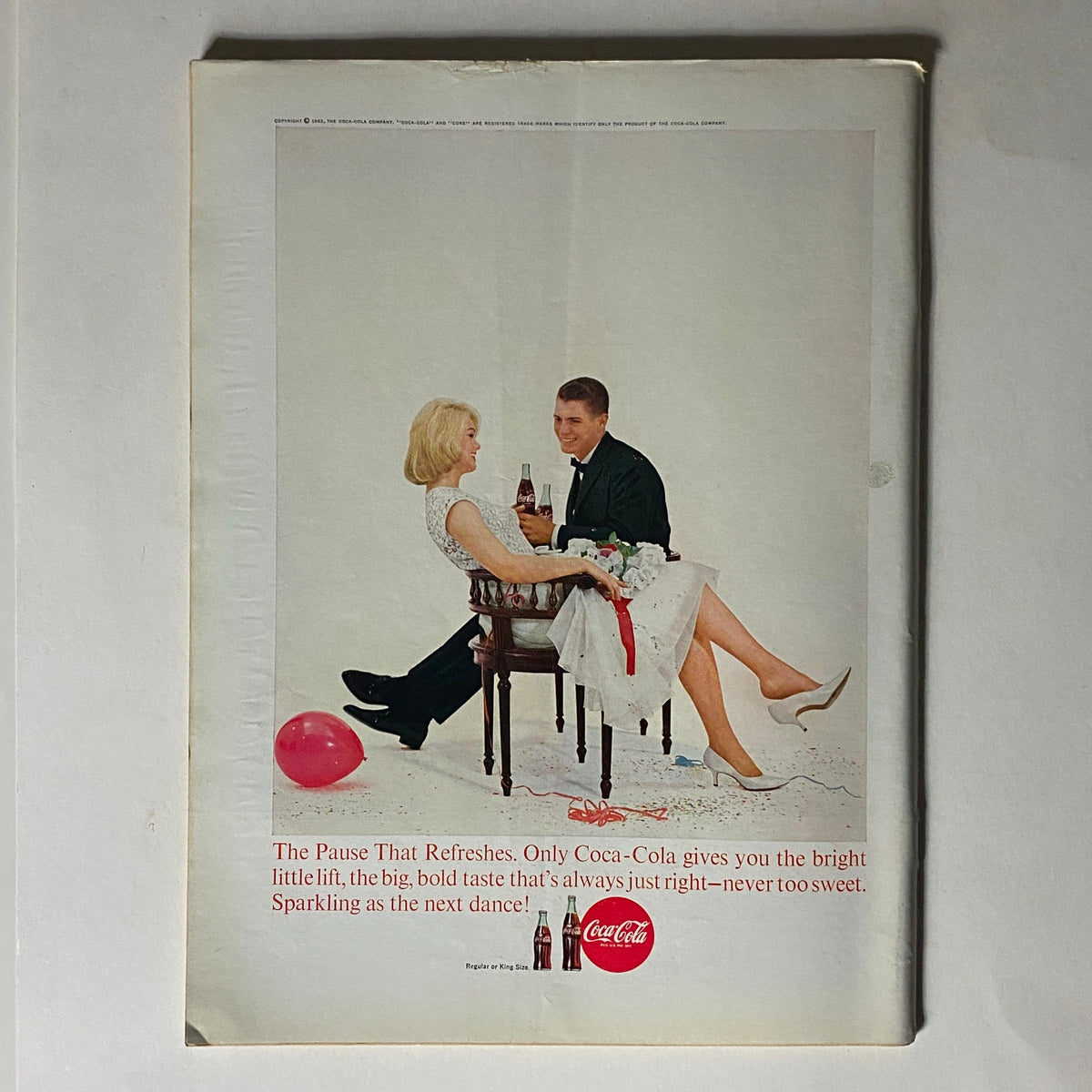 The New Yorker Complete Magazine February 2, 1963 back cover advertisement for Coca-Cola, showcasing a stylish couple enjoying drinks in a celebratory setting.