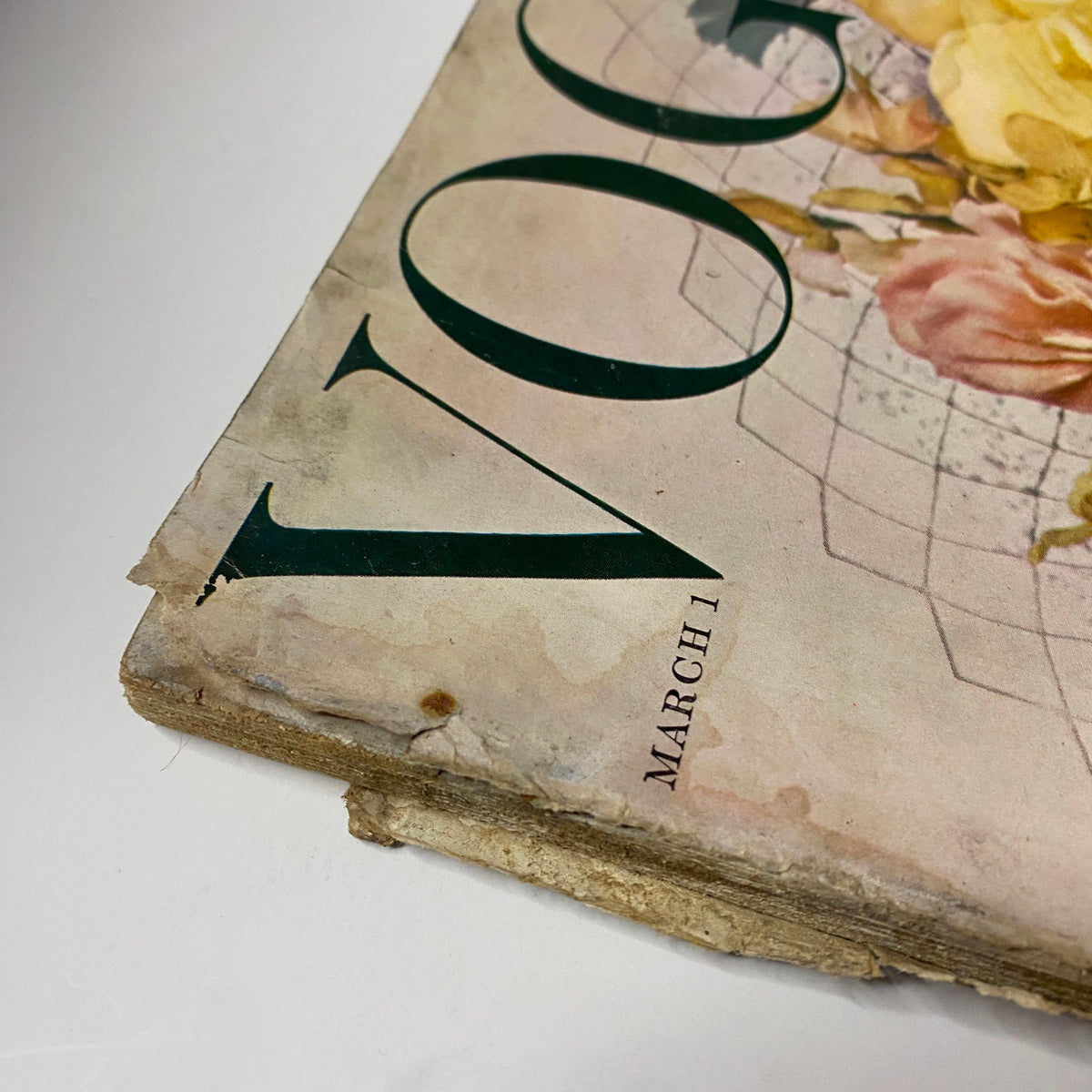 Detailed view of the edge of Vogue Magazine March 1, 1959 showing worn condition with visible wear and tear, preserving a piece of fashion history captured by Irving Penn.