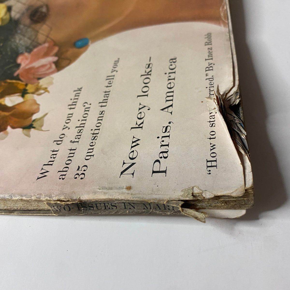 Vogue Magazine March 1, 1959 side view highlighting the vintage cover's condition with creases and edge wear, featuring Isabella Albonico styled by Irving Penn.
