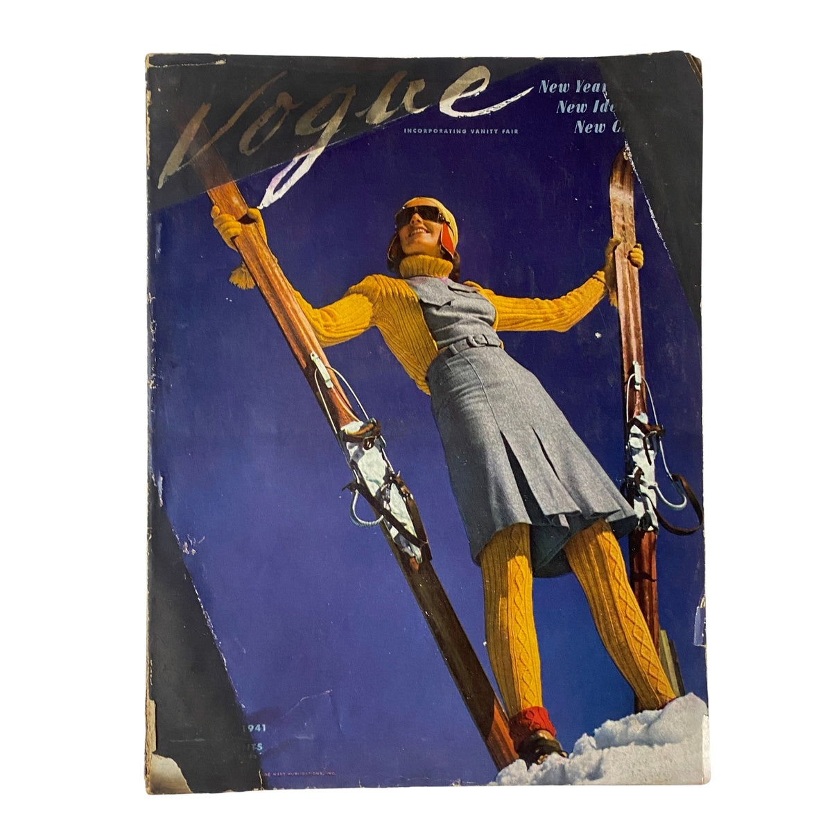 Vogue Magazine cover from January 1, 1941 featuring a Ski Girl, photographed by Toni Frissell. The cover showcases a model in a stylish ski outfit, emphasizing winter fashion and outdoor sports.