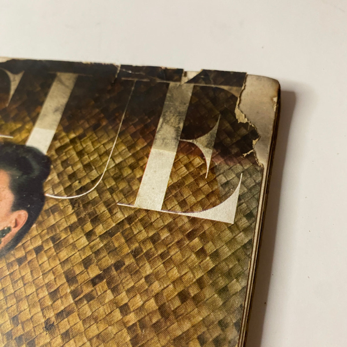 Close-up of Vogue Magazine June 1, 1943 Florence Dornin Cover by John Rawlings, showing torn cover edge and vintage texture.