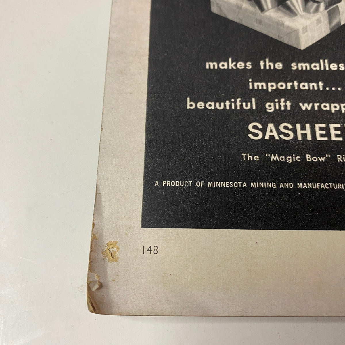 Back cover example of Vogue Magazine from March 15, 1955 featuring a gift wrapping advertisement and the title 'Vogue Magazine March 15, 1955 Sunny Harnett by John Rawlings GD Interior'. Visible page number 148 suggesting vintage magazine wear.