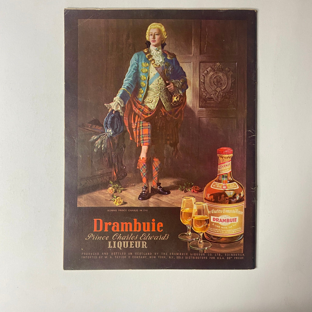 Back cover of Gourmet Magazine April 1955 featuring an artistic depiction of a gentleman in historical attire promoting Drambuie liqueur.