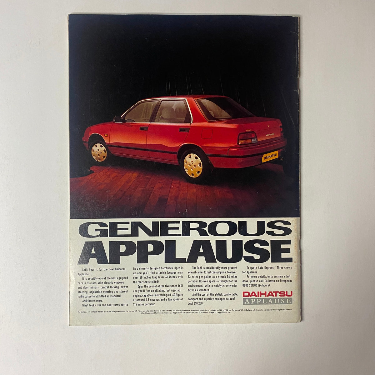 Advert for the Daihatsu Applause featured in the Car Magazine UK Import 1990 Special Supplement 'The Car in the Future', showcasing a red car against a dramatic background with a focus on its appeal.