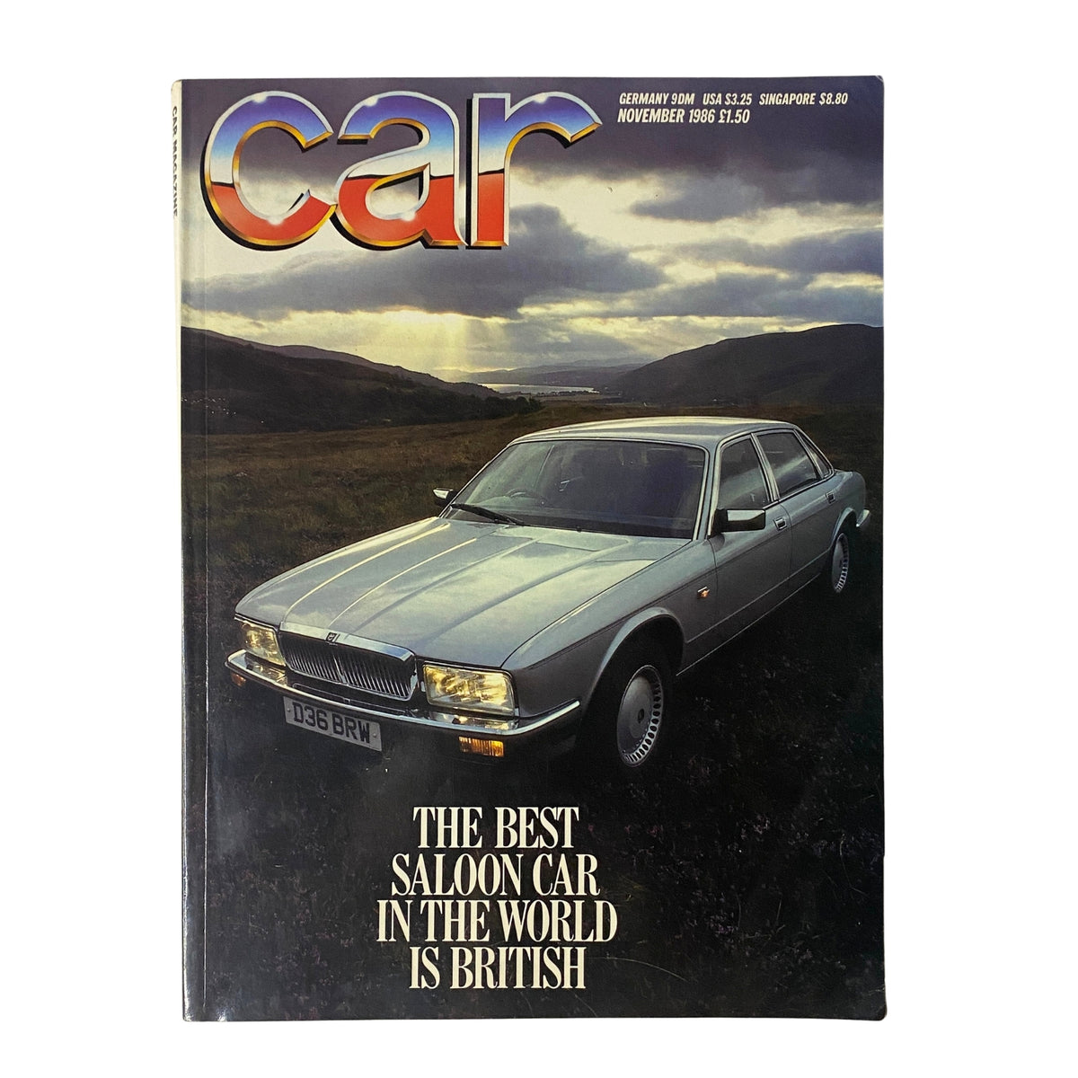 Car Magazine UK Import November 1986 cover featuring the headline 'The Best Saloon Car is British' showcasing a classic Jaguar XJ40 against a scenic backdrop.