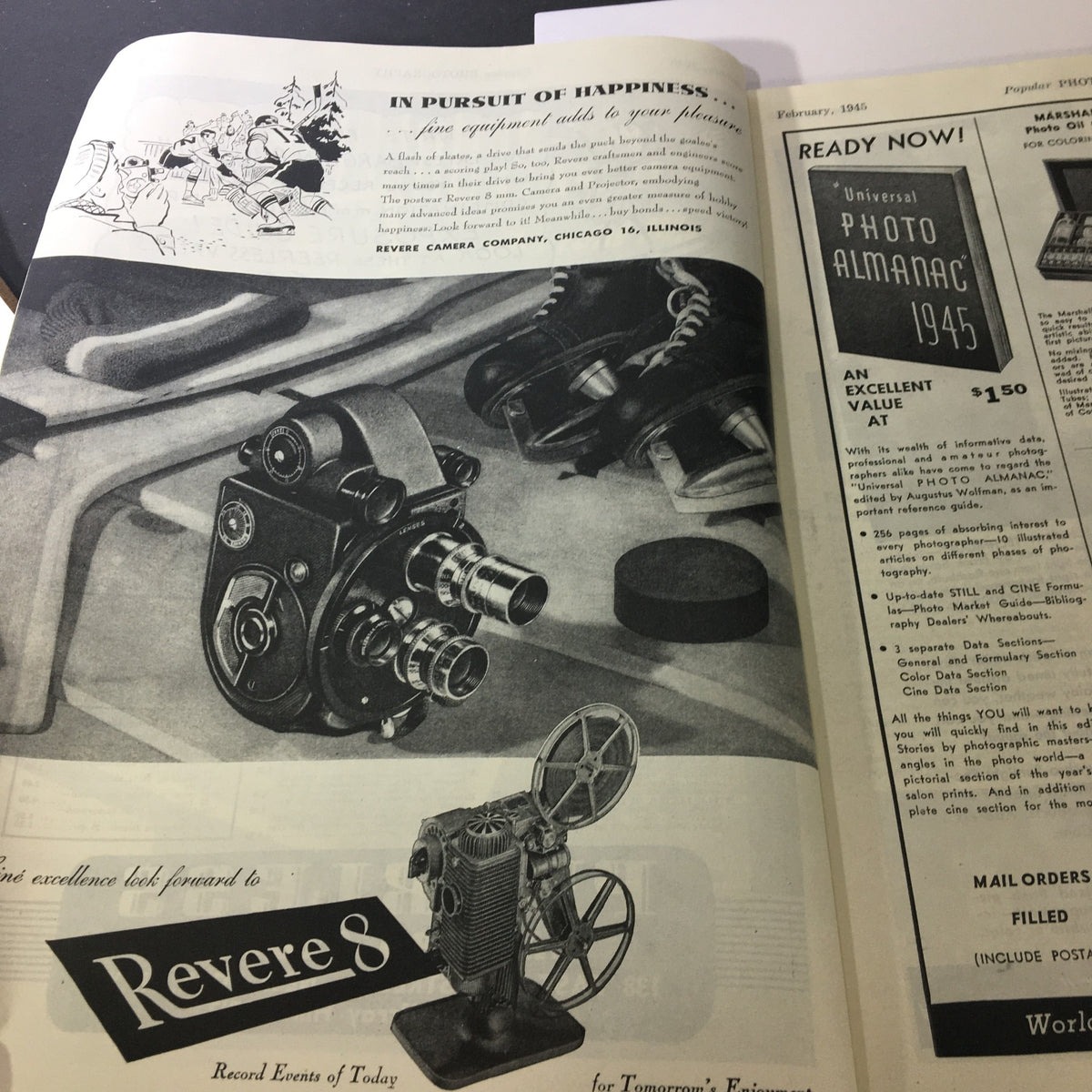 Revere Camera Company advertisement in Popular Photography Magazine February 1945, highlighting film equipment and cameras.
