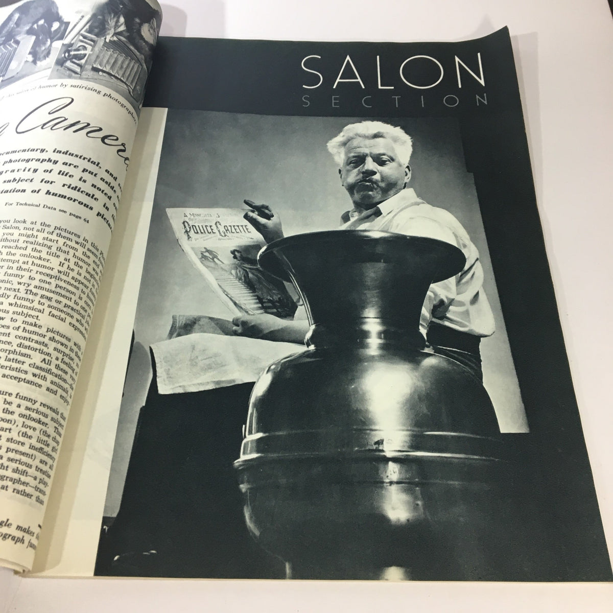Interior view of VTG Popular Photography Magazine February 1945 featuring a man reading a vintage publication in the Salon Section. This edition highlights George Bernard Shaw on the cover.