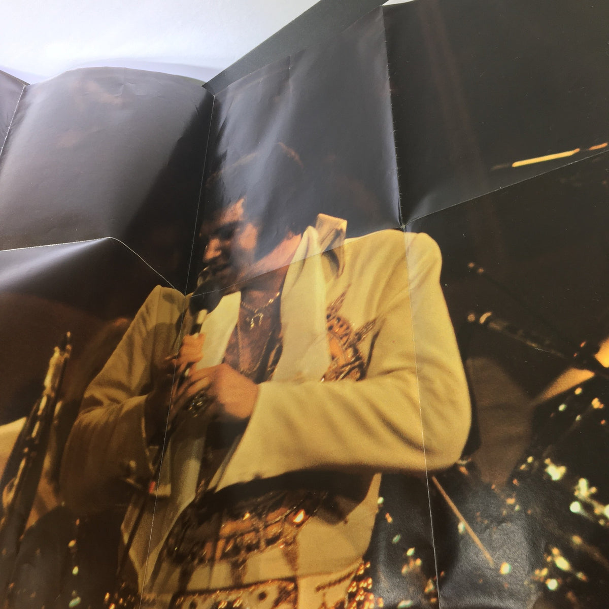 VTG 1977 Elvis Presley A Pictorial Tribute photograph showcasing Elvis performing during his last tour, capturing the energy and emotion of the moment.