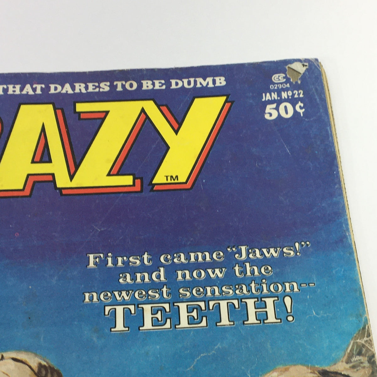Close-up of the cover of VTG Stan Lee Crazy Magazine January 1977 #22 highlighting the title 'CRAZY' and humorous tagline about 'Teeth!', representing 1970s comic book humor.