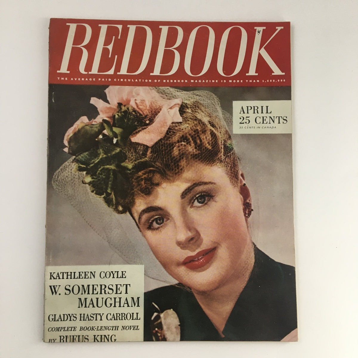 VTG Redbook Magazine April 1944 cover featuring a woman with a floral hat and elegant hairstyle, showcasing the captivating story 'The Adventure of the Incautious Guest.'