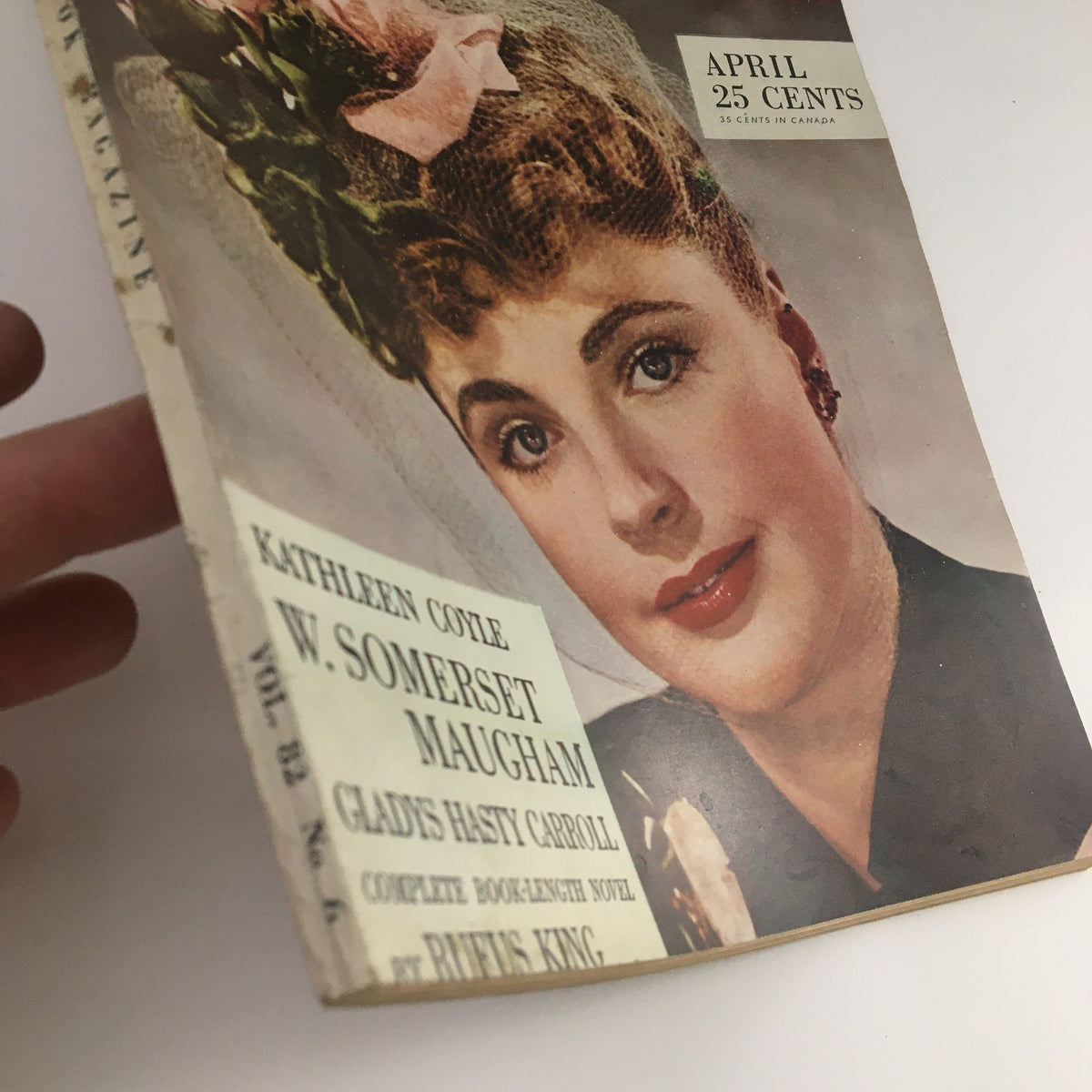 Side view of VTG Redbook Magazine April 1944 cover highlighting the woman's vintage hairstyle and the title details, 'The Adventure of the Incautious Guest.'