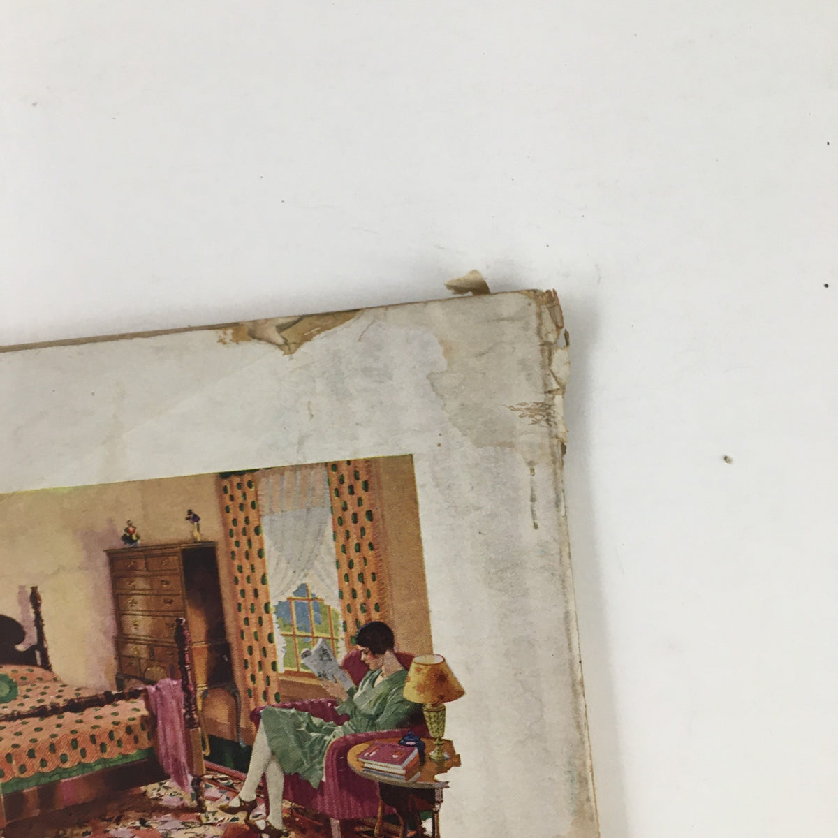 Better Homes & Gardens May 1930 magazine image highlighting a woman reading in a vintage styled room with Congoleum rugs.
