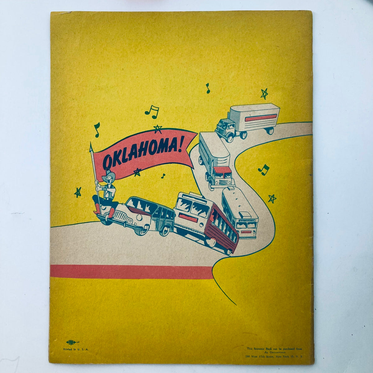 Back cover of the VTG 1953 Oklahoma! Stage Play Souvenir Program featuring a whimsical illustration of vehicles with a banner reading 'Oklahoma!'