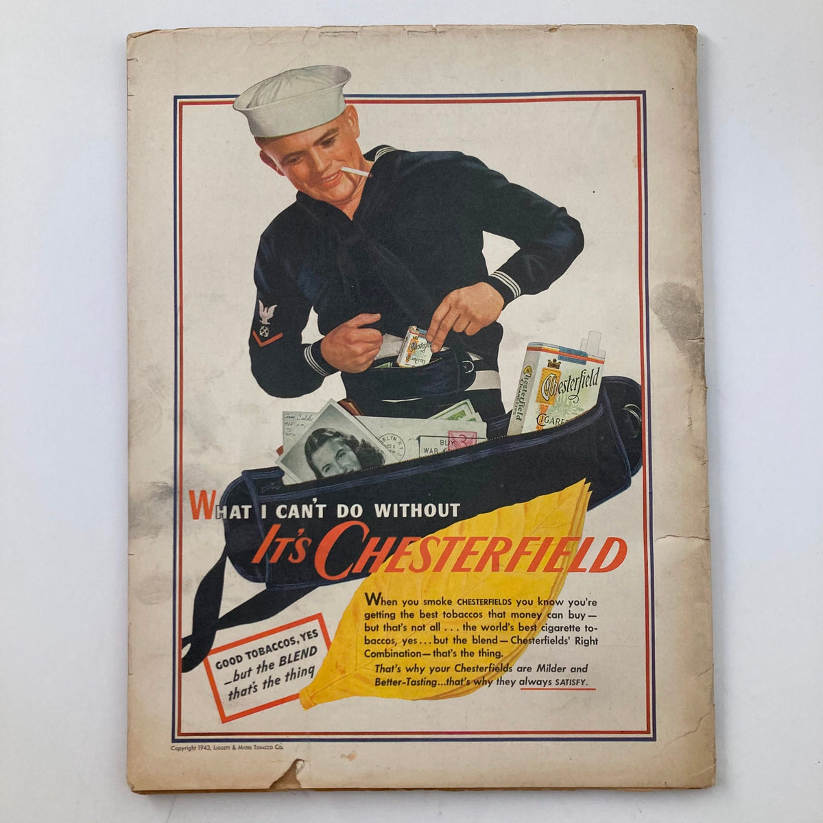Back cover of VTG True Story Magazine November 1943 featuring an ad for Chesterfield cigarettes with a sailor holding money.