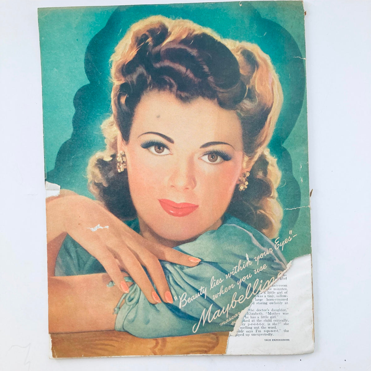 Back cover of VTG True Experiences Magazine February 1943, displaying an advertisement for Maybelline cosmetics with an elegant woman's portrait, highlighting 1940s beauty standards.
