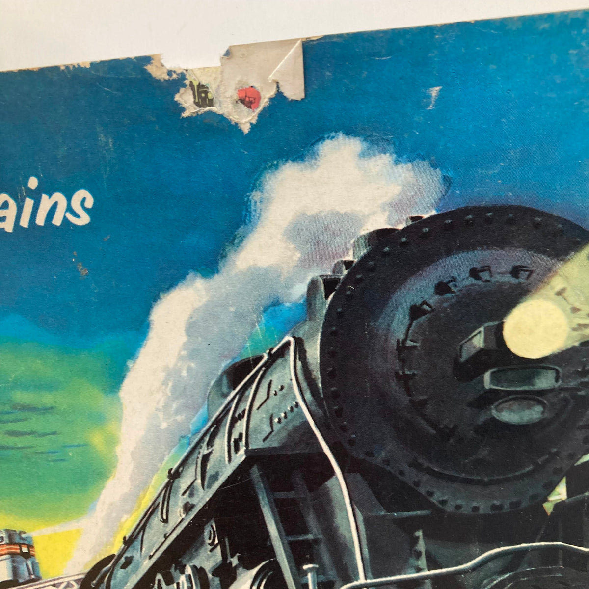 Close-up detail of the cover of a vintage magazine titled 'VTG 1952 American Flyer Trains and Gilbert Toys 282 325 Silver Streak 360', showing a steam locomotive with artistic elements.