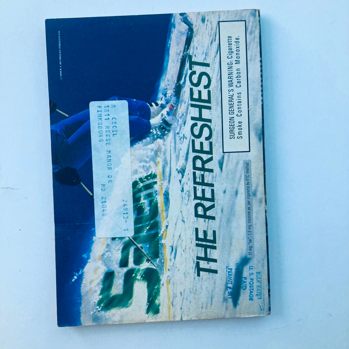 Back cover of The Cable Guide Magazine, April 1988, showcasing an advertisement with a visual of a winter sports scene.