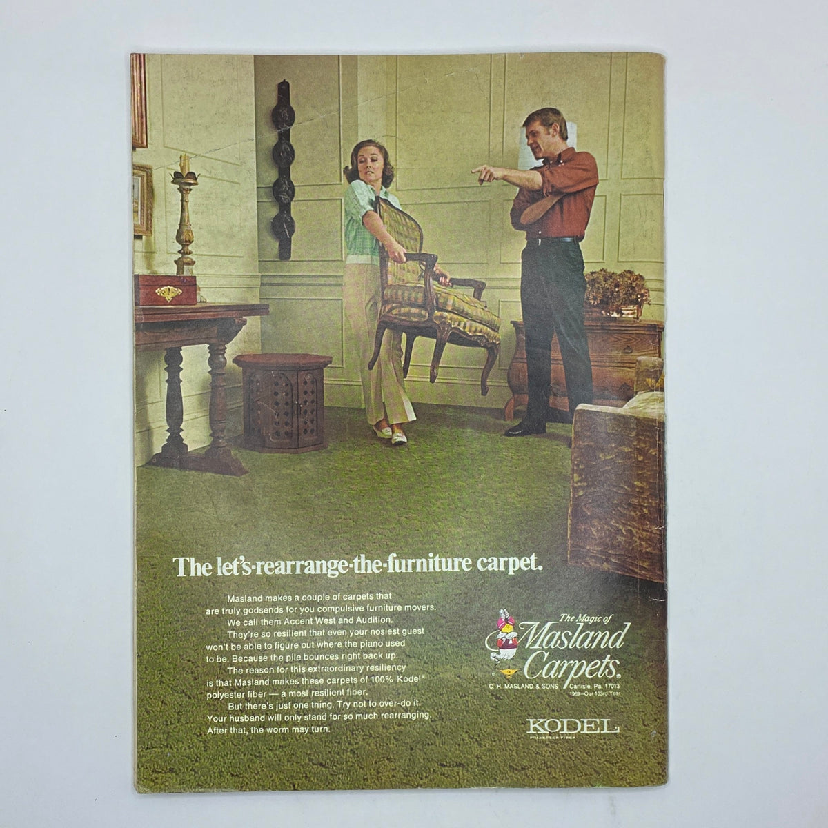 Advertisement for Masland Carpets featured in The New Yorker magazine June 7, 1969, depicting a couple discussing furniture arrangement in a stylish living room.