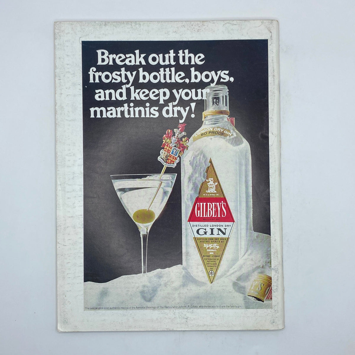 Back cover advertisement for Gilbey's London Dry Gin from The New Yorker magazine, March 29, 1969, featuring a martini and a bottle of gin with the tagline, 'Break out the frosty bottle, boys, and keep your martinis dry!'