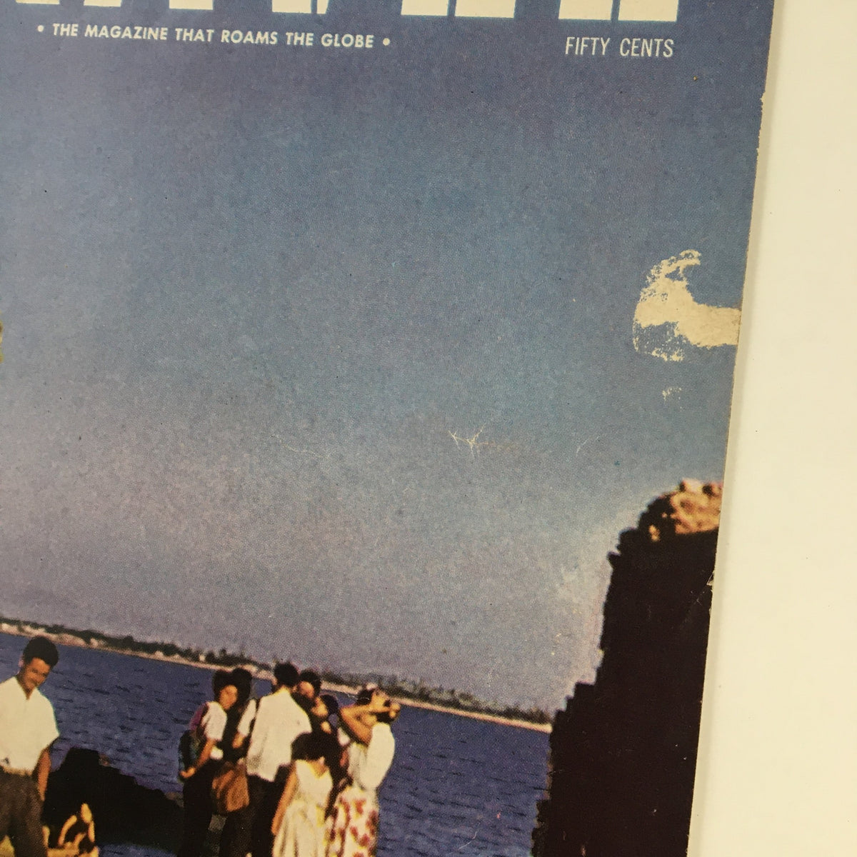 Close-up of the cover of VTG Travel Magazine November 1959 showcasing the title and coastal scene of Acre, Israel.