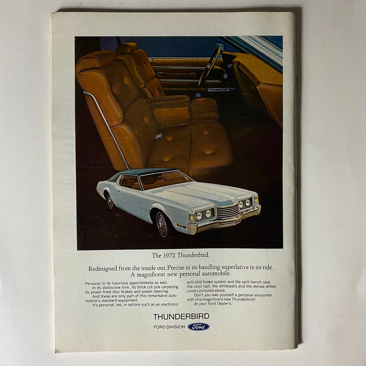 1972 Thunderbird advertisement featuring a white car and detailed interior design. The ad emphasizes luxurious appointments and features of the Thunderbird, showcasing its elegant style and performance, tied to The New Yorker Complete Magazine March 4, 1972 with James Stevenson Cover.