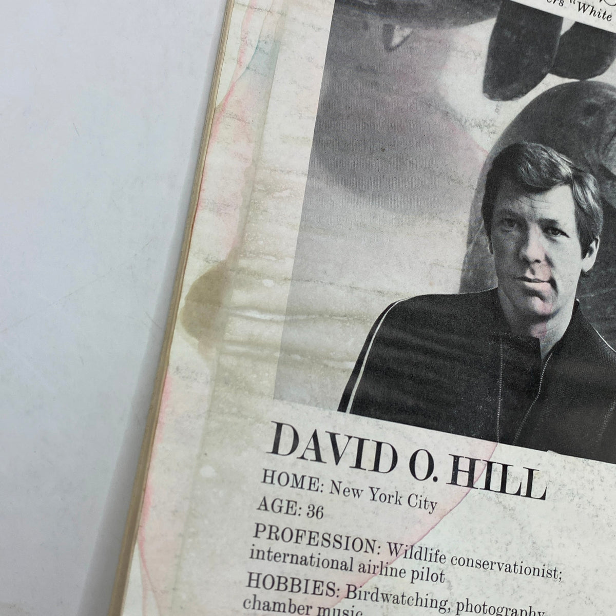 Close-up view of 'Dewar's Profiles' article from The New Yorker Complete Magazine March 7, 1977, highlighting David O. Hill's career and hobbies.