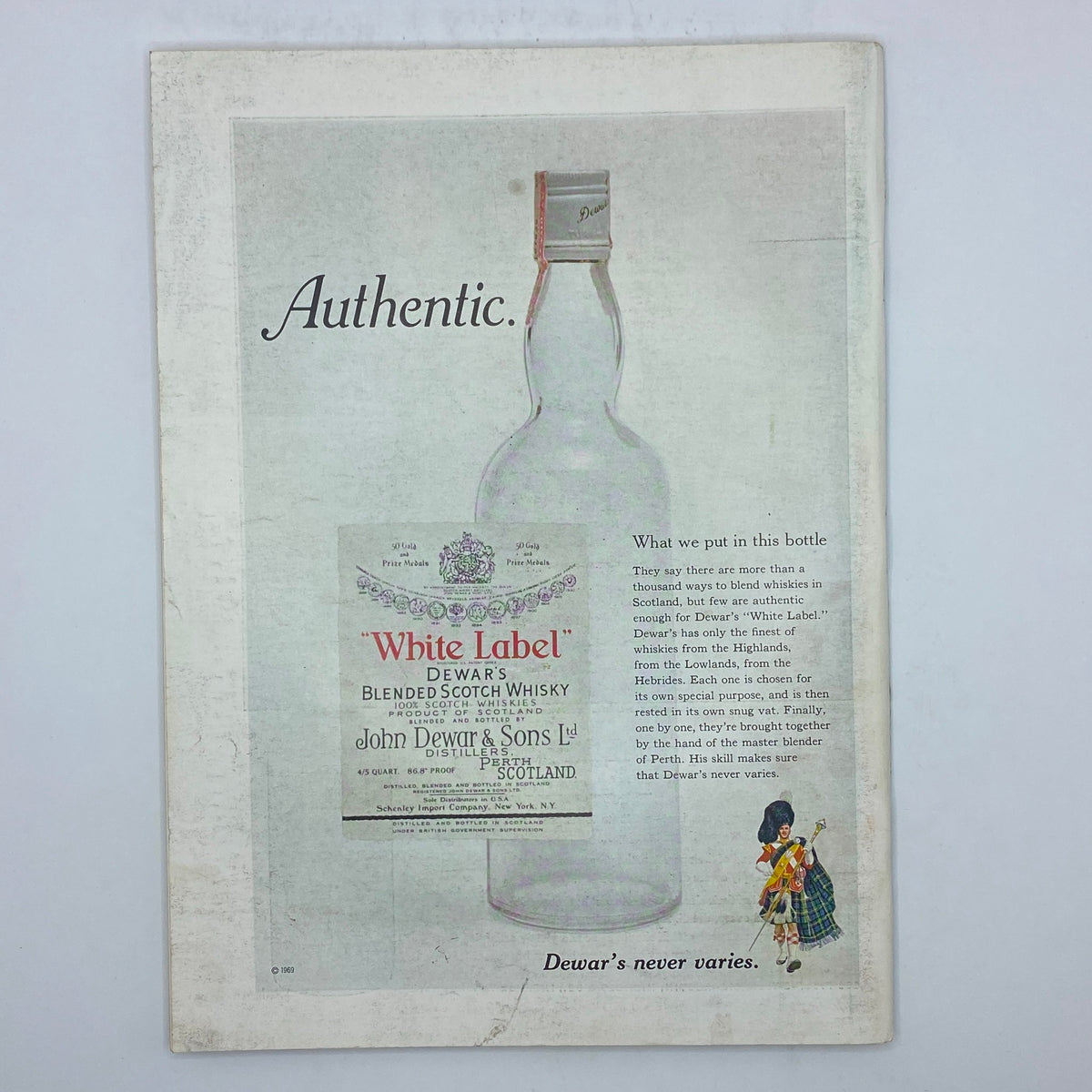 Authentic advertisement for Dewar's White Label Blended Scotch Whisky, prominently displaying the bottle and marketing text.