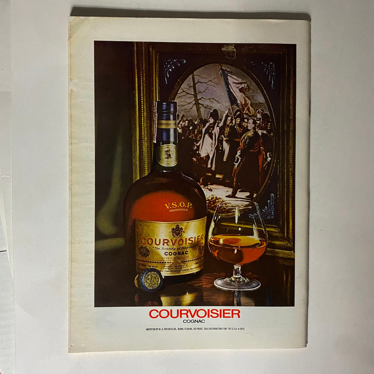 Advertisement page for Courvoisier Cognac featured in The New Yorker magazine September 6, 1976, showcasing a bottle of V.S.O.P. Cognac and a glass.