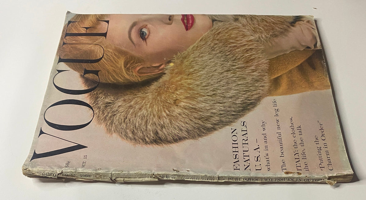 Vogue Magazine cover from October 15, 1960 with Angela Howard by Tom Palumbo, displaying the magazine's iconic title and emphasis on fashion, including features on U.S. fashion and modern trends.