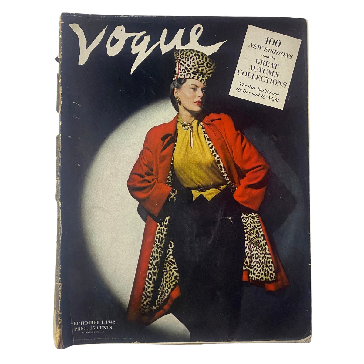 Cover of Vogue Magazine September 1, 1942 featuring Meg Mundy in bold fashion, photographed by John Rawlings. The cover showcases a model in a striking red coat and leopard print hat, emphasizing autumn fashion trends.