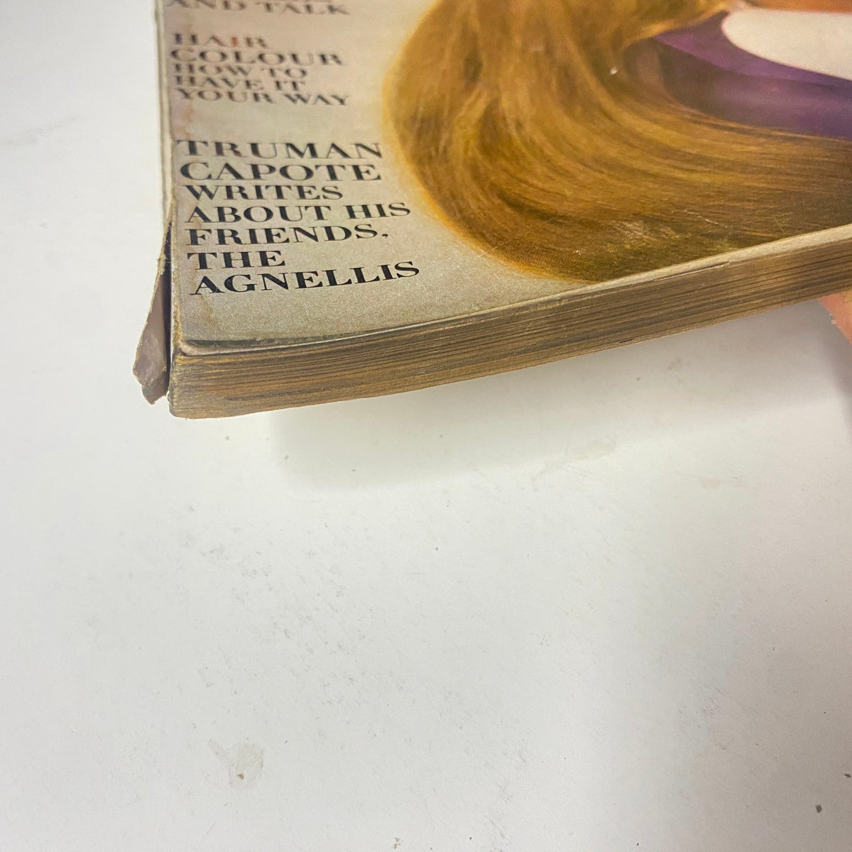 Vogue Magazine April 1, 1969 Suzy Kendall Cover by David Bailey showing a close-up of the magazine's spine with notable wear, highlighting its vintage condition.