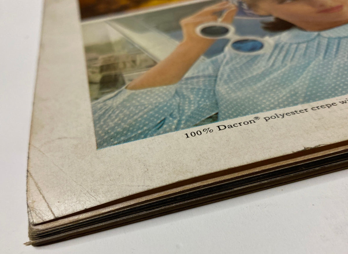 Close-up of Vogue Magazine January 1, 1966, highlighting the vintage details of a model's attire, specifically featuring 100% Dacron polyester fabric.