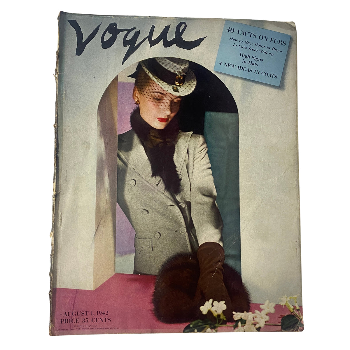 Vogue Magazine August 1, 1942 cover featuring Lenore Simon, photographed by Horst P. Horst. The cover showcases a model in a stylish gray coat with a fur accessory, emphasizing fashion trends from the 1940s.