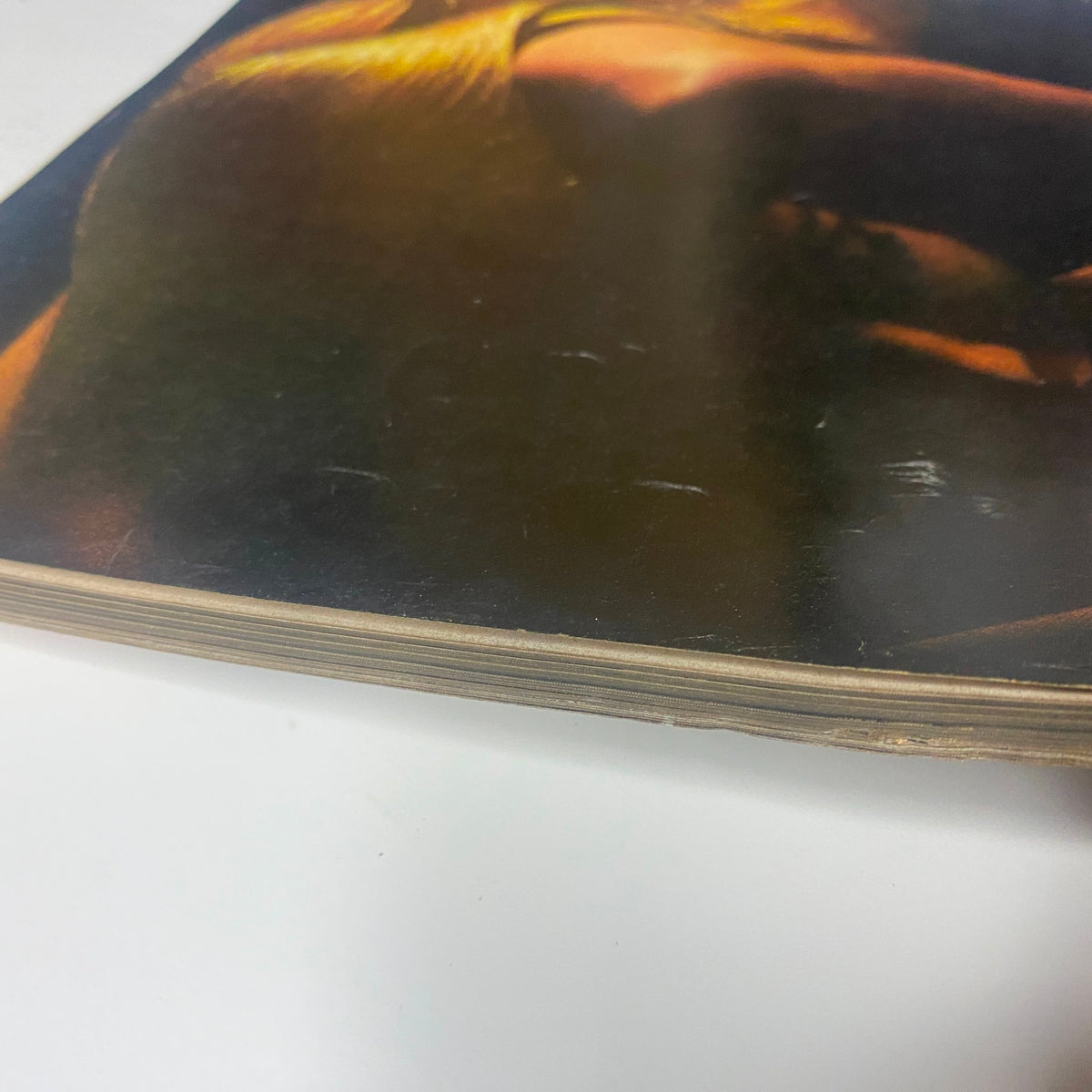 Another close-up view of the edge of Vogue Magazine August 15, 1968 Lauren Hutton Cover by Gianni Penati, highlighting its age and collectible condition.