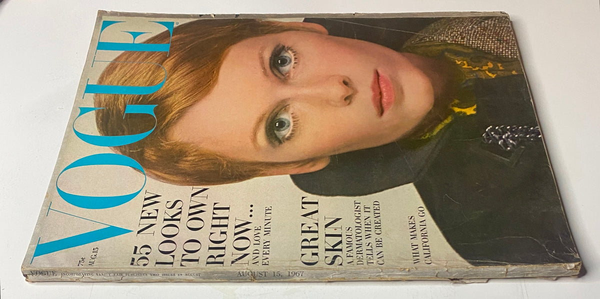 Close-up view of the cover of Vogue Magazine August 15, 1967 with Mia Farrow, showcasing the title and striking imagery. The photograph captures the essence of 1960s fashion.